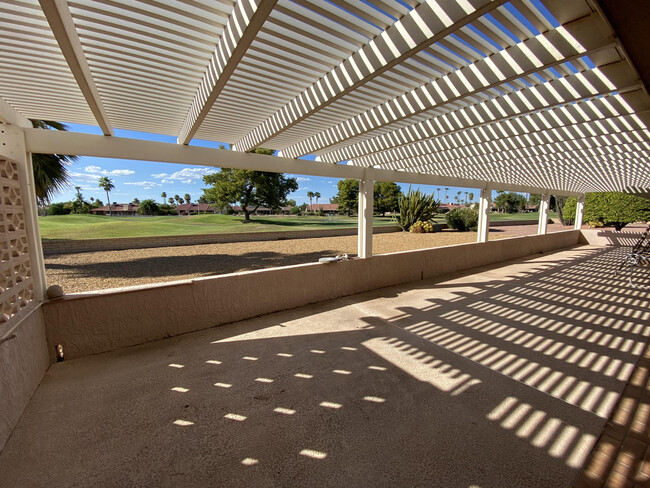 Fully covered lanai off kitchen + approx 60' alumawood patio shade cover - 13722 W Elmbrook Dr