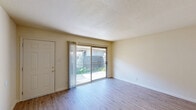 Located at 295 E Olive Ave in Merced, CA, this 2-bedroom, 1-bathroom unit offers a practical and well-organized single-floor layout. Light wood-style flooring runs throughout, creating a clean and cohesive look across every room.

The living room is a comfortable, open space featuring a sliding glass door that leads to a private outdoor patio area, allowing natural light to fill the room and providing a seamless connection to the exterior. The kitchen is galley-style, finished with white cabinetry, white appliances including a dishwasher and range, and a window that brings in additional natural light.

The primary bedroom is generously sized, featuring a large sliding-door closet, a window, and direct access to the hallway leading to the bathroom. The second bedroom is well-proportioned, also benefiting from a window with natural light and its own closet space. Both bedrooms share clean, neutral walls and the same light flooring found throughout the unit.

The bathroom is efficiently designed, featuring a tiled tub/shower combination, a vanity with under-sink storage, and a well-lit mirror. A hallway connects the main living areas to the bedrooms and bathroom. The outdoor area includes a private enclosed patio, offering additional usable space.