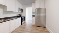 Located at 746 Fanshawe Park Rd E in London, Ontario, this well-appointed one-bedroom, one-bathroom unit offers a thoughtfully designed layout across a single floor. Light-toned laminate flooring runs throughout, complementing the clean white walls and creating a bright, cohesive aesthetic.

The open-concept combined dining and living area is generously sized, bathed in natural light through a large sliding door that leads to a private balcony with pleasant outdoor views of surrounding greenery. The kitchen is a standout feature, showcasing white shaker-style cabinetry, dark countertops, and a full suite of stainless steel appliances including a refrigerator, electric range, and over-the-range microwave.

The bedroom is a comfortable, well-lit space benefiting from a large window with tree-lined views and a wide built-in sliding-door closet providing ample storage. Additional closets are distributed throughout the unit, offering practical storage solutions. The four-piece bathroom is finished with neutral stone-look tile flooring, white subway tile surrounding the bathtub and shower, and crisp white fixtures. A dedicated entrance and additional storage closets round out this functional and modern unit.