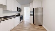 Located at 746 Fanshawe Park Rd E in London, Ontario, this well-appointed one-bedroom, one-bathroom unit offers a thoughtfully designed layout across a single floor. Light-toned laminate flooring runs throughout, complementing the clean white walls and creating a bright, cohesive aesthetic.

The open-concept combined dining and living area is generously sized, bathed in natural light through a large sliding door that leads to a private balcony with pleasant outdoor views of surrounding greenery. The kitchen is a standout feature, showcasing white shaker-style cabinetry, dark countertops, and a full suite of stainless steel appliances including a refrigerator, electric range, and over-the-range microwave.

The bedroom is a comfortable, well-lit space benefiting from a large window with tree-lined views and a wide built-in sliding-door closet providing ample storage. Additional closets are distributed throughout the unit, offering practical storage solutions. The four-piece bathroom is finished with neutral stone-look tile flooring, white subway tile surrounding the bathtub and shower, and crisp white fixtures. A dedicated entrance and additional storage closets round out this functional and modern unit.