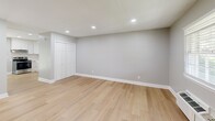 Located at 500 Savannah St in Greensboro, NC, this efficiently designed studio unit offers a well-organized single-floor layout that maximizes every square foot. The open kitchen and living area serves as the heart of the space, featuring a modern kitchen equipped with stainless steel appliances — including a range, dishwasher, and refrigerator — complemented by crisp white shaker cabinetry, a classic white subway tile backsplash, light stone countertops, and an undermount sink. The light wood-tone luxury vinyl plank flooring runs throughout, creating a cohesive and easy-to-maintain finish. The living area is bathed in natural light from a window with blinds, and recessed lighting overhead ensures the space remains bright at all times. Neutral gray walls and clean white trim give the interior a fresh, contemporary feel. A wall-mounted HVAC unit and a baseboard heater provide climate control options. A closet with bi-fold doors offers convenient storage. The full bathroom features a tub/shower combination with white tile surround and brushed nickel fixtures, providing a clean and functional design. This unit presents a practical and move-in-ready option in Greensboro.