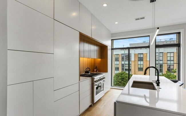 Building Photo - Sophisticated two-bedroom condo with ample...