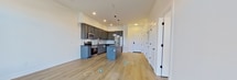 This contemporary 620 square foot apartment in Newport News, VA, showcases a thoughtful blend of style and functionality. The open-concept design seamlessly integrates the kitchen and living areas, creating a spacious feel despite the compact footprint. The kitchen is a standout feature, boasting sleek gray cabinetry, stainless steel appliances, and a contrasting dark countertop. A subway tile backsplash adds a touch of classic elegance.

The 120 square foot bedroom is bathed in natural light thanks to large windows, and features the same warm wood-look flooring found throughout the apartment. The bathroom is notably spacious, with a modern vanity, large mirror, and a tub/shower combination adorned with stylish tile work.

High ceilings and recessed lighting contribute to the airy ambiance, while the neutral color palette provides a blank canvas for personal decorating styles. The apartment's single floor layout ensures easy accessibility, with a closet for additional storage. Overall, this apartment offers a perfect blend of modern amenities and efficient design, ideal for those seeking a contemporary living space in a convenient location.