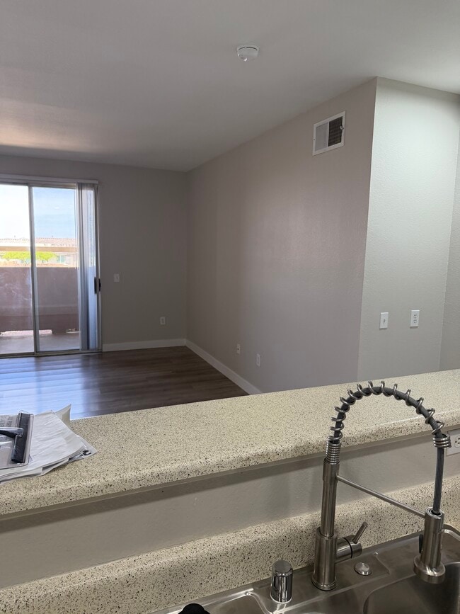 view of living room and sliding glass doors over patio - 231 W Horizon Ridge Pky