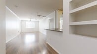 This contemporary apartment in Marina Del Rey offers a spacious 1050 square feet of living area on a single floor. The layout comprises three bedrooms, including a primary bedroom of 160 square feet, two full bathrooms, and an open-concept kitchen and living room area. The interior is characterized by its modern aesthetic, featuring sleek wood flooring throughout that adds warmth and continuity to the space.

The kitchen is a highlight, boasting honey-toned wooden cabinetry, granite countertops, and stainless steel appliances, including a gas range and built-in microwave. A convenient in-unit laundry area is tucked away, enhancing the apartment's functionality.

The bathrooms are designed with practicality in mind, featuring wooden vanities, ample storage, and shower-tub combinations. Large windows in the bedrooms and living areas flood the space with natural light, while ceiling fans provide air circulation and ambient lighting.

Storage solutions are plentiful, with walk-in closets in the bedrooms and additional closet space in the hallway. The apartment's neutral color palette, predominantly white walls, creates a bright and airy atmosphere, offering residents a blank canvas to personalize their living space.

Located at 3221 Carter Ave, Unit 283, this apartment combines modern comfort with the desirable Marina Del Rey location, making it an attractive option for those seeking a contemporary living space in a sought-after area.