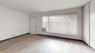 Located on Idaho Street in Palm Desert, California, this single-story, one-bedroom, one-bathroom unit offers a well-organized and efficient layout across its single floor. Light wood-style flooring runs throughout the entire space, lending a clean and cohesive aesthetic to every room.

The living room is bright and open, featuring a large window with vertical blinds that allows natural light to fill the space and provides outdoor views. A wall-mounted air conditioning unit offers climate control. The adjoining dining area flows naturally from the living room, creating a connected and functional common space.

The kitchen is positioned toward the rear of the unit, equipped with light-toned cabinetry, open shelving, and a countertop workspace — offering practical utility within a compact footprint. A hallway connects the main living areas to the private spaces, which include two closets for storage.

The bedroom is a cozy, well-defined room with a window that brings in natural light and outdoor views, complemented by its own closet access. The bathroom is clean and functional, featuring a shower-tub combination, a white vanity with stone-look countertop, a mirrored medicine cabinet with built-in shelving, and matching white fixtures throughout.

The unit also includes access to a private patio, providing a dedicated outdoor space. The overall ambiance is neutral, clean, and move-in ready.