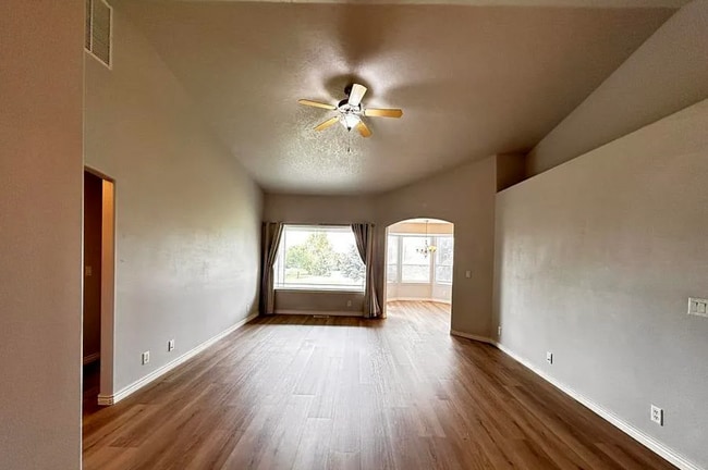 Living room with picture window - 8455 W Harmonica Way