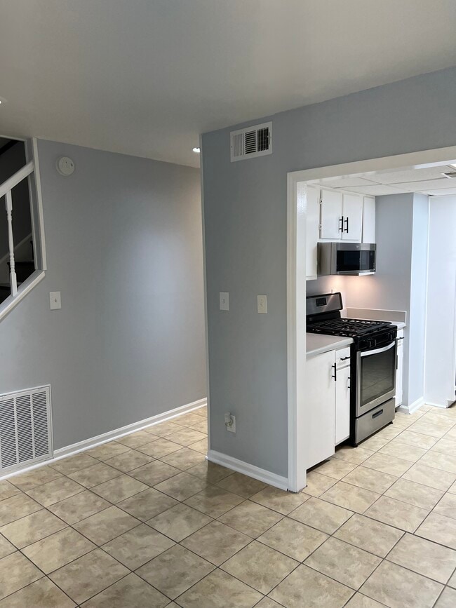 Wider angle view of dinning room to kitchen - 6419 Baker Ct