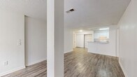 Located at 3529 Robins Landing Way in Decatur, GA, this single-story home offers four bedrooms, two bathrooms, and a practical, well-organized layout. Consistent wood-look flooring runs throughout the entire home, providing a cohesive and easy-to-maintain finish. Textured ceilings and crisp white walls create a clean, neutral backdrop across all rooms.

The open living area connects seamlessly to the kitchen, which features a galley-style design with white cabinetry, laminate countertops, a coil-burner electric range, a refrigerator, a dishwasher, and an in-unit washer. A pass-through counter opens the kitchen to the living space, enhancing the sense of openness.

The four bedrooms are bright and practical, with several rooms featuring windows that bring in natural light. Each bedroom benefits from dedicated closet space, with four closets total throughout the home. The primary bedroom offers a comfortable and functional footprint.

The two bathrooms are finished in a consistent style, each featuring a tub-shower combination, wood-look flooring, and white fixtures. One bathroom includes a wall-mounted sink and accessibility grab bars, while the other offers a more traditional vanity setup with overhead lighting and a mirror.

Overall, the home presents a clean, move-in-ready interior with a straightforward and functional design throughout.