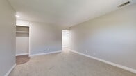 Located at 2029 Key St in Maumee, OH, this single-floor, three-bedroom, one-bathroom residence offers a practical and well-organized layout. The unit features a consistent neutral color palette with soft gray walls and clean white trim throughout, creating a cohesive and calming atmosphere.

Each of the three bedrooms is carpeted in a warm beige tone, providing comfort underfoot. The spacious primary bedroom offers generous square footage and connects to an adjacent area with pendant lighting, suggesting a pass-through or additional room. The secondary bedrooms are well-proportioned, with one featuring a bright window that allows natural light to fill the space. Ample storage is a notable feature, with four closets distributed throughout the unit, including a visible rod-equipped closet in one of the bedrooms.

The full bathroom is finished with wood-look vinyl flooring, a light wood vanity with a marble-style countertop, a large mirror, and a tiled tub-shower combo — offering a clean, updated aesthetic. A central hallway connects the rooms efficiently, contributing to the unit's functional flow. Textured ceilings and visible HVAC vents are consistent throughout, reflecting a practical residential design suited for comfortable everyday living.