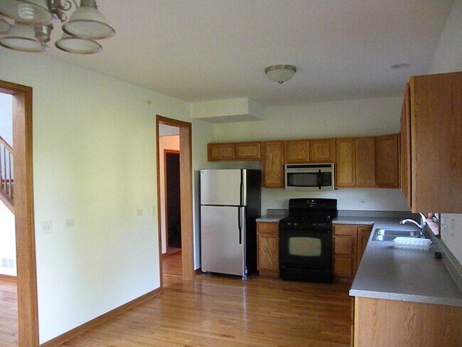 kitchen with appliances - 391 E Rickert St