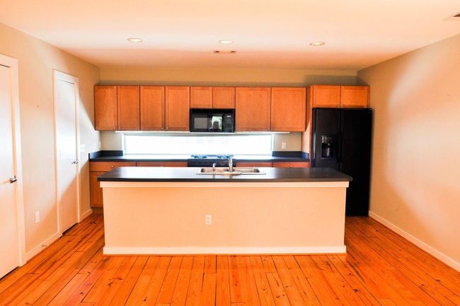 Living room flows into open kitchen. - 920 Memorial Dr SE