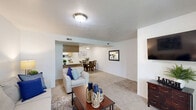 Located in West Jordan, Utah, this single-floor, 2-bedroom, 2-bathroom home offers a thoughtfully arranged layout designed for comfortable everyday living. The welcoming living room features plush carpeting, a sliding glass door that fills the space with natural light and provides access to an outdoor balcony, creating a bright and open atmosphere. Adjacent to the living room, the dedicated dining area is finished with tile flooring and flush-mount ceiling lighting, providing a clean and defined space for meals. The kitchen is positioned conveniently nearby for easy entertaining flow. The generously sized primary bedroom is a comfortable retreat, featuring soft carpet, ample wall space, and a walk-in closet equipped with wire shelving. The second bedroom also offers carpeted flooring, a closet, and direct hallway access. Both bathrooms are finished with tile flooring and light-toned cabinetry; one includes a full shower-tub combination. A dedicated utility room adds practical storage and laundry functionality. Throughout the home, neutral wall tones and consistent flooring choices create a cohesive and clean aesthetic, making this West Jordan residence a practical and inviting place to call home.