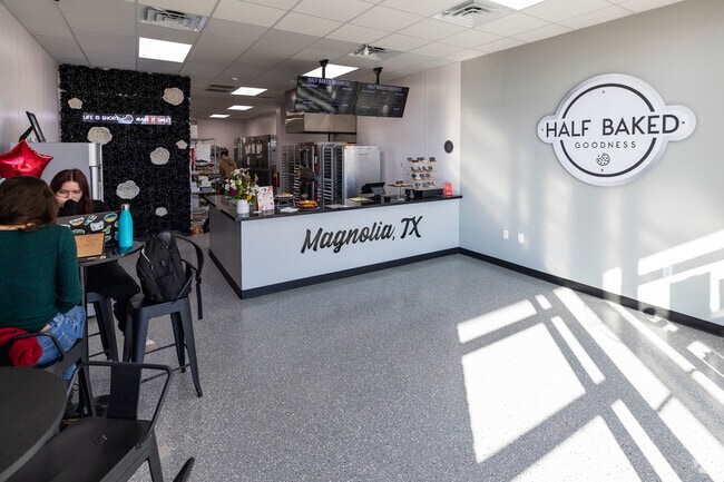 Patrons sit inside Half Baked Goodness near Karen.