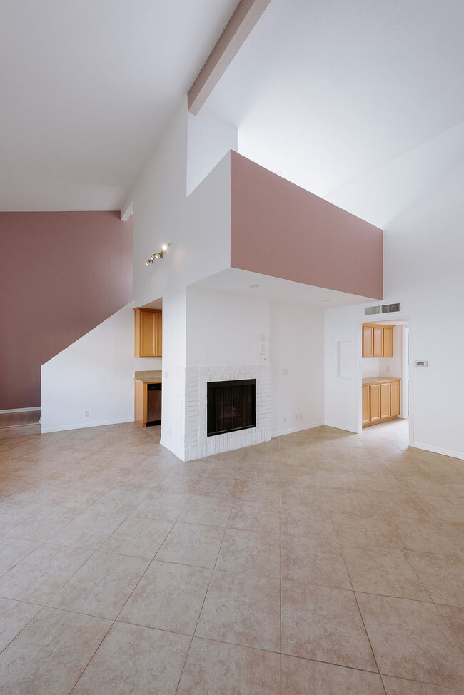 Living area, fireplace, loft overhang - 3651 Jasmine Ave