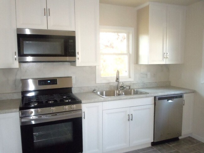 Building Photo - Three Bedroom Home with LL Family Room and...