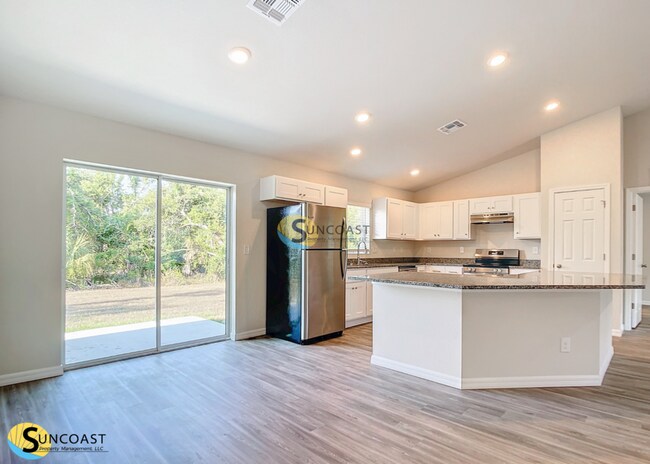 Building Photo - APP FEE WAIVED:  4-Bedroom Home with Slidi...