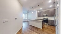 This well-designed 750 square foot apartment in Orlando offers a perfect blend of style and functionality. The heart of the home is a sleek, modern kitchen featuring granite countertops, stainless steel appliances, and ample storage with grey wood-grain cabinetry. The open-concept layout seamlessly connects the kitchen to the living area, which is adorned with warm wood-look flooring.

The spacious bedroom, measuring 130 square feet, is carpeted for comfort and includes a large window for natural light. The bathroom boasts a contemporary design with a glass-enclosed shower, wood-look flooring, and a vanity with storage.

Convenience is key with an in-unit laundry room equipped with a washer and dryer. The apartment also features a balcony, offering outdoor space for relaxation or entertainment. Throughout the space, recessed lighting and ceiling fans add both style and comfort.

Located at 10007 Palma Linda Way in Orlando, this single-floor apartment combines modern amenities with practical living space, making it an ideal choice for those seeking a contemporary urban lifestyle.