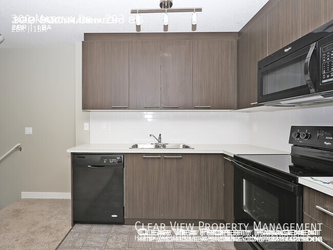 Photo du bâtiment - 2 Bedroom Chestermere Station Condos - 1 b...