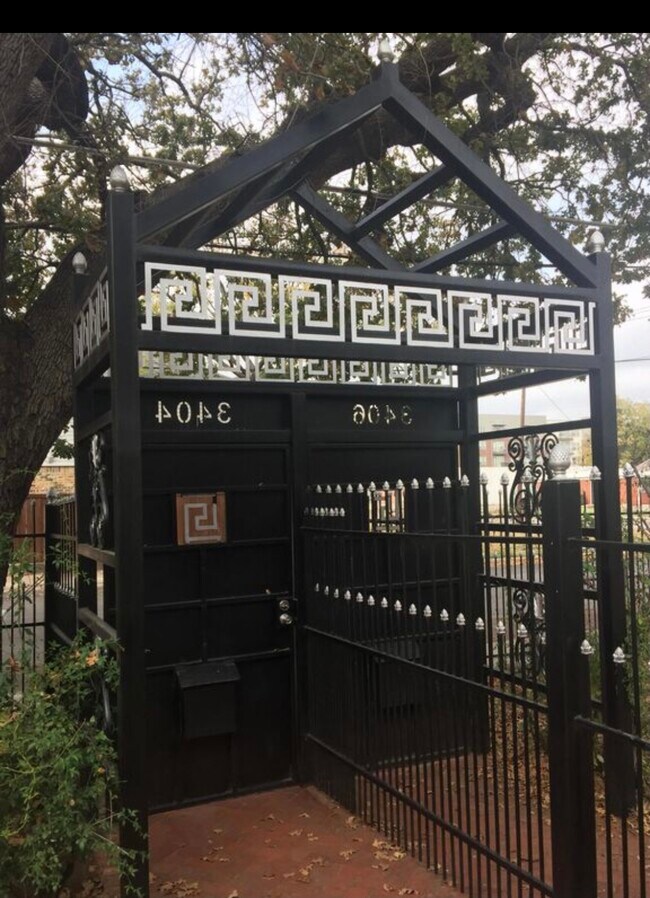 Inside gated entry - 3404 San Jacinto St