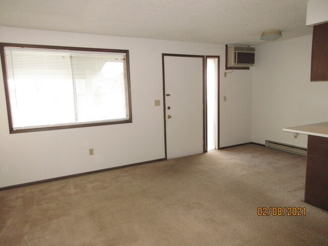 living room + AC - 921 E Nora Ave