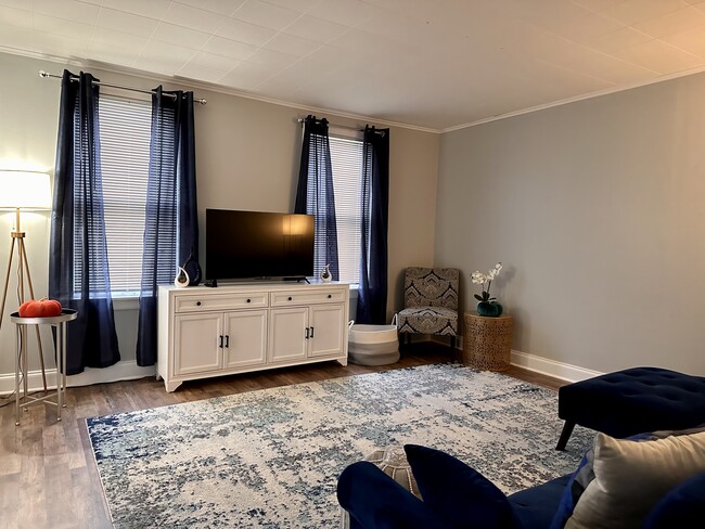 Living Room with Couch, TV, lamps & chair - 1206 Noyes St