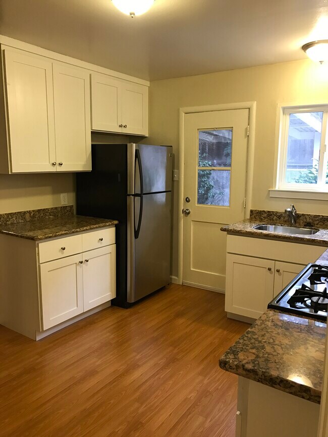 Kitchen with door to private garden/patio - 130 Jackson Ave