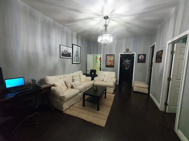 Left to Right: Bathroom, kitchen, bookshelf and bedroom entrance - 523 E 21st St