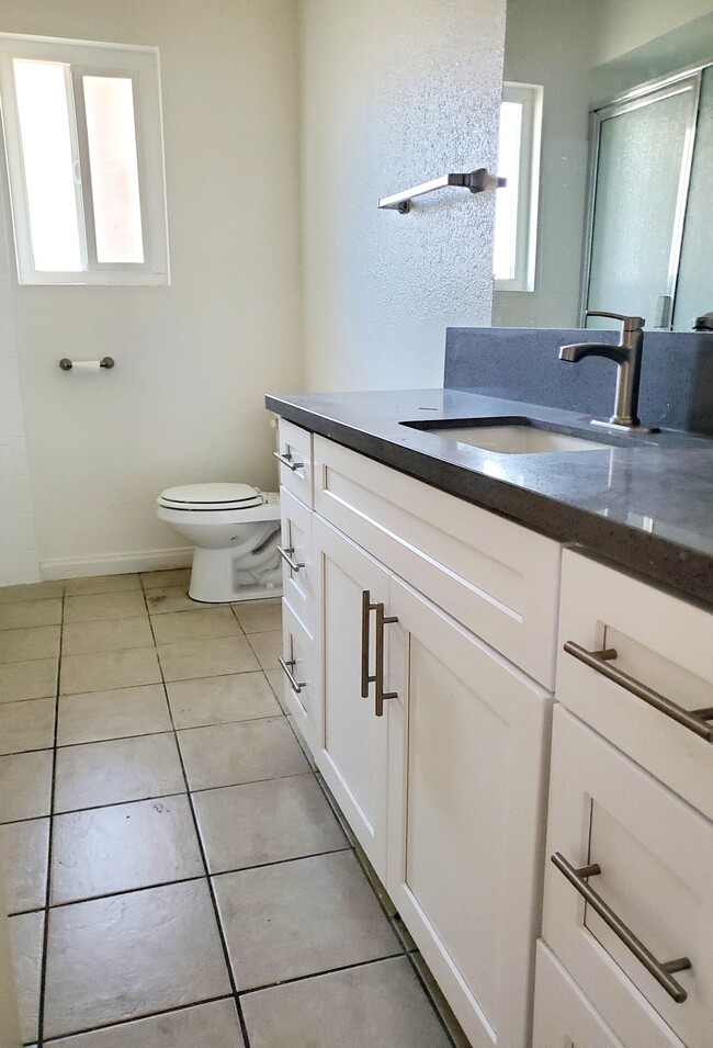 Bathrooms with new cabinets and countertops - 3455 Elm Ave