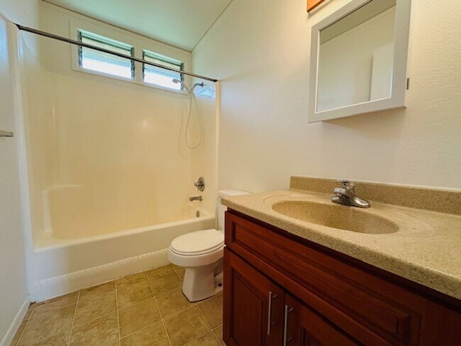 Building Photo - 2 Bedroom, 1.5 bathroom with 2 Open Parking
