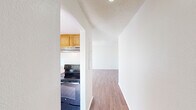 This well-designed 1050 square foot apartment offers a comfortable living space with three bedrooms and two bathrooms. The kitchen is a highlight, featuring oak cabinetry, ample counter space, and modern stainless steel appliances including a refrigerator and dishwasher. The living area boasts warm wood-look flooring and large windows that flood the space with natural light.

The bedrooms are generously sized, with the primary bedroom measuring 170 square feet. Plush carpeting in the bedrooms adds a cozy touch. The bathrooms are functional and bright, with one featuring a tiled shower enclosure and the other a combination of wood flooring and white fixtures.

The apartment includes an in-unit laundry room with full-sized washer and dryer, adding convenience to daily life. Throughout the space, neutral wall colors provide a blank canvas for personalization. The open floor plan and thoughtful layout maximize the use of space, creating an inviting and practical home environment.

Located in the Summit West complex, this apartment offers a blend of comfort and functionality, ideal for those seeking a modern living space in a convenient location.