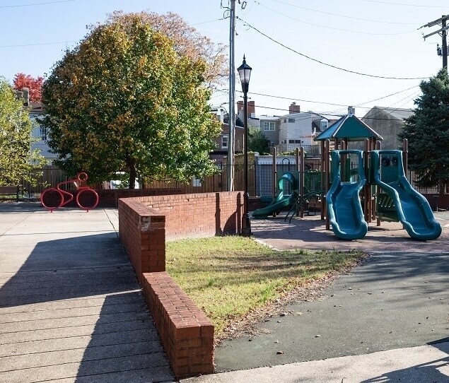 Residents with children head to Conway Street Park, located near Camden Yards