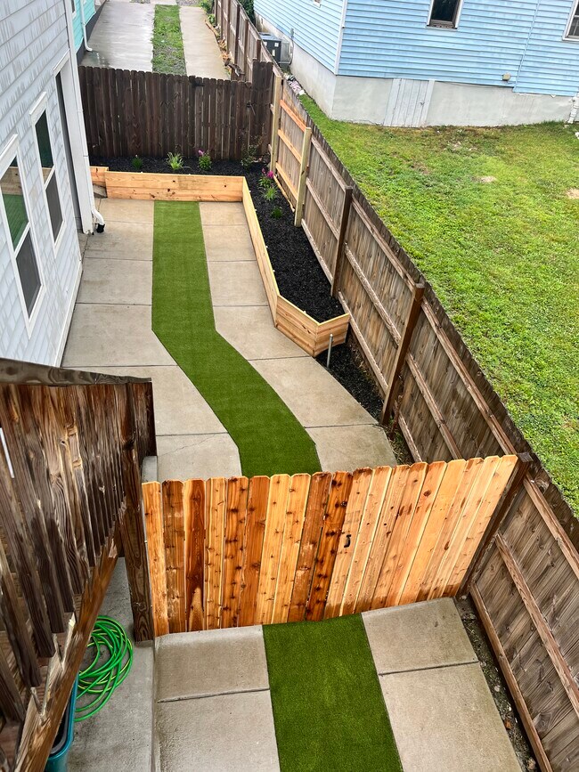 Common outdoor living area. Stairs to unit. - 135 Fain St