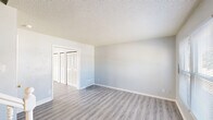 Located at 1108 City Ave in Atlantic City, NJ, this two-story home offers three bedrooms and two bathrooms across two evenly divided floors. The layout is thoughtfully organized, with living spaces on the lower level and bedrooms above, connected by two staircases and complemented by a hallway for easy navigation.

The kitchen is a functional highlight, featuring gray cabinetry with brushed silver hardware, warm-toned countertops, a double-basin sink, and black gas appliances including a range and refrigerator. Light vinyl plank flooring runs throughout the kitchen and living areas, providing a clean, cohesive look.

The bedrooms are carpeted in soft gray tones and bathed in natural light from well-placed windows with exterior views. Each bedroom benefits from dedicated closet space, and the home boasts an impressive total of eight closets, ensuring exceptional storage throughout. The primary bedroom offers a generous footprint with double closet doors.

Both bathrooms are finished with tile flooring. One features a tub-shower combination with clean white surroundings, while the other includes a white vanity with a mirror and wall-mounted lighting. Textured ceilings and neutral gray walls create a consistent, calm aesthetic throughout the home, making it a practical and comfortable residence.