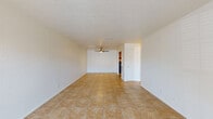This 680 square foot apartment in Summit West offers a practical and comfortable living space. The single-story unit features a well-designed layout with one bedroom and one bathroom. The living area is spacious, with large windows allowing plenty of natural light and providing a view of the surroundings. Ceramic tile flooring extends throughout the main living spaces, while the bedroom boasts plush carpeting for added comfort.

The kitchen is efficiently designed with wooden cabinetry, providing ample storage space. It comes equipped with essential appliances, including a refrigerator, and offers counter space for meal preparation. A notable feature is the in-unit laundry facilities, with a washer and dryer conveniently tucked away in a dedicated closet.

The bathroom showcases a clean, white design with a bathtub-shower combination. The bedroom is generously sized at 160 square feet, featuring a built-in closet and a ceiling fan for improved air circulation. Throughout the apartment, neutral wall colors create a blank canvas for personal decorating styles.

The overall ambiance of the apartment is bright and inviting, with an open-concept design that maximizes the use of space. Ceiling fans in both the living area and bedroom provide additional comfort. This apartment offers a practical and low-maintenance living solution, ideal for singles or couples seeking a cozy, well-appointed home.