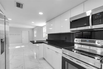 Building Photo - 5061 W 12th Ln