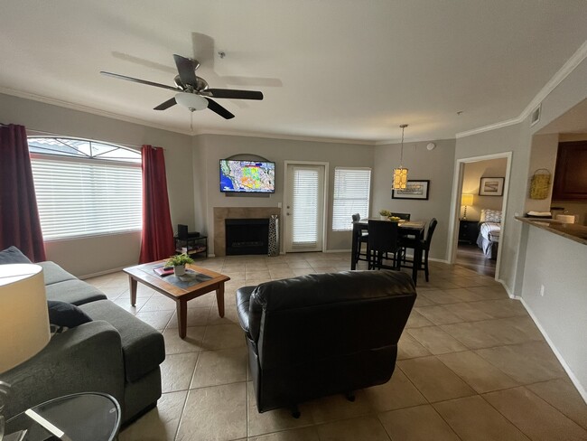 LIVING ROOM WITH FRENCH DOOR TO PATIO - 15095 N Thompson Peak Pky