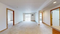 This well-designed apartment offers 940 square feet of comfortable living space on a single floor. The layout includes two bedrooms, two full bathrooms, and an open-concept living and dining area. The primary bedroom is generously sized at 160 square feet, providing ample space for relaxation.

The kitchen is a standout feature, boasting oak cabinetry, a functional L-shaped design, and white appliances including a range and dishwasher. The living area is bright and airy, with large windows allowing natural light to flood the space. Plush carpeting in the living room and bedrooms adds warmth and comfort.

Both bathrooms are well-appointed, featuring tile flooring, vanities with ample storage, and combination tub/shower units. The apartment also includes the convenience of in-unit laundry facilities.

Throughout the home, you'll find practical amenities such as ceiling fans, baseboard heating, and window treatments. The neutral color palette and clean lines create a versatile canvas for various decor styles.

Located at 11022 75th Street in Kenosha, Wisconsin, this apartment offers a blend of comfort and convenience in a desirable location. With its thoughtful design and array of features, this space provides an ideal setting for comfortable, modern living.