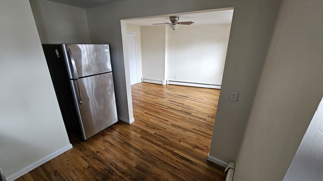 Kitchen opens to main living space - 61 E Main St