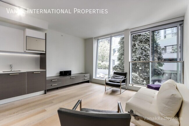 Building Photo - Modern Coal Harbour Studio with Luxury Amenities