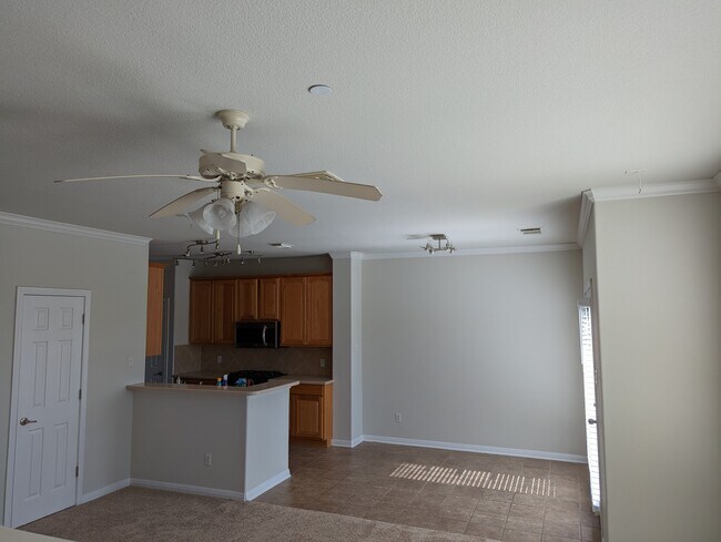 View of kitchen and dining from living area - 1101 E Parmer Ln