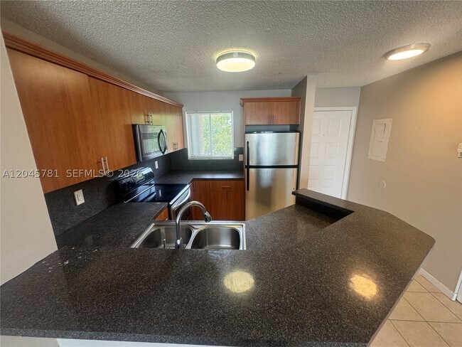 Building Photo - 8750 N Sherman Cir