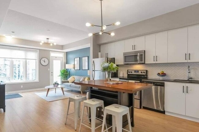 Building Photo - $3,200/MO – Stunning 2 Bedroom/2.5 Bath Stacked Townhouse