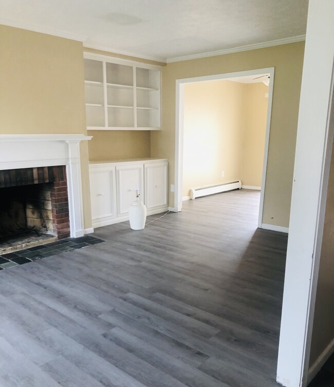 Newly updated flooring pictured here in the living room - 8 Meadowlawn Dr