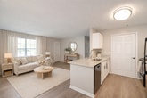 This Arbor Grove townhome offers a generous 1,530 square feet of living space spread across three floors. The layout comprises four bedrooms, including a spacious 180 square foot primary bedroom, two full bathrooms, and a combined kitchen and living room area. The home features a mix of flooring types, with sleek hardwood in the main living areas and plush carpeting in select bedrooms.

The kitchen is equipped with modern white cabinetry, contrasting black appliances, and a practical layout. Large windows throughout the home allow for abundant natural light, creating a bright and airy atmosphere. The bathrooms are designed with functionality in mind, featuring clean lines and contemporary fixtures.

The property includes additional spaces such as a utility room, two hallways for easy navigation, a staircase connecting the floors, and a closet for storage. Each floor offers a different amount of space: 490 square feet on the ground floor, 540 square feet on the first floor, and 490 square feet on the second floor.

The neutral color palette used throughout the home provides a blank canvas for personalization. With its thoughtful design and ample space, this Arbor Grove townhome presents a comfortable and versatile living environment suitable for various lifestyle needs.