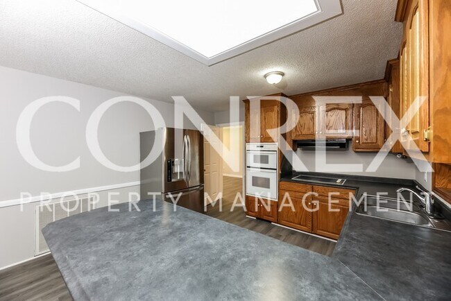 Building Photo - Beautiful Brick 4 Bedroom Ranch