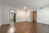 Located at 777 Mount Moriah Road in Memphis, TN, this 2-bedroom, 1-bathroom single-story home offers a thoughtfully updated interior with a clean, modern aesthetic. Warm wood-look flooring flows consistently throughout every room, tying the space together with a cohesive and inviting feel.

The living room is bright and welcoming, featuring large windows that invite abundant natural light and views of the surrounding greenery. The space is open and functional, ideal for both relaxing and entertaining.

The kitchen is a standout feature, showcasing white shaker-style cabinetry with black hardware, a herringbone marble-style tile backsplash, light quartz countertops, and stainless steel appliances including a refrigerator, range, microwave, and dishwasher. A skylight adds additional brightness to the space.

Both bedrooms are well-sized, with the primary bedroom offering a comfortable layout, a ceiling fan with light, and a closet with built-in shelving. The second bedroom also features a ceiling fan and natural light from a window. Each room benefits from clean white walls and recessed lighting.

The bathroom is elegantly finished with floor-to-ceiling marble-look tile surrounding the soaking tub and shower, complemented by matte black fixtures and a window for natural ventilation. A hallway connects the rooms efficiently, completing this move-in-ready home.
