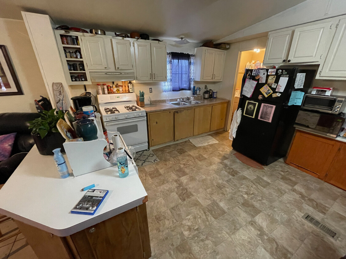 Large kitchen with wrap-around counters. - 1122 S Bowen Ave