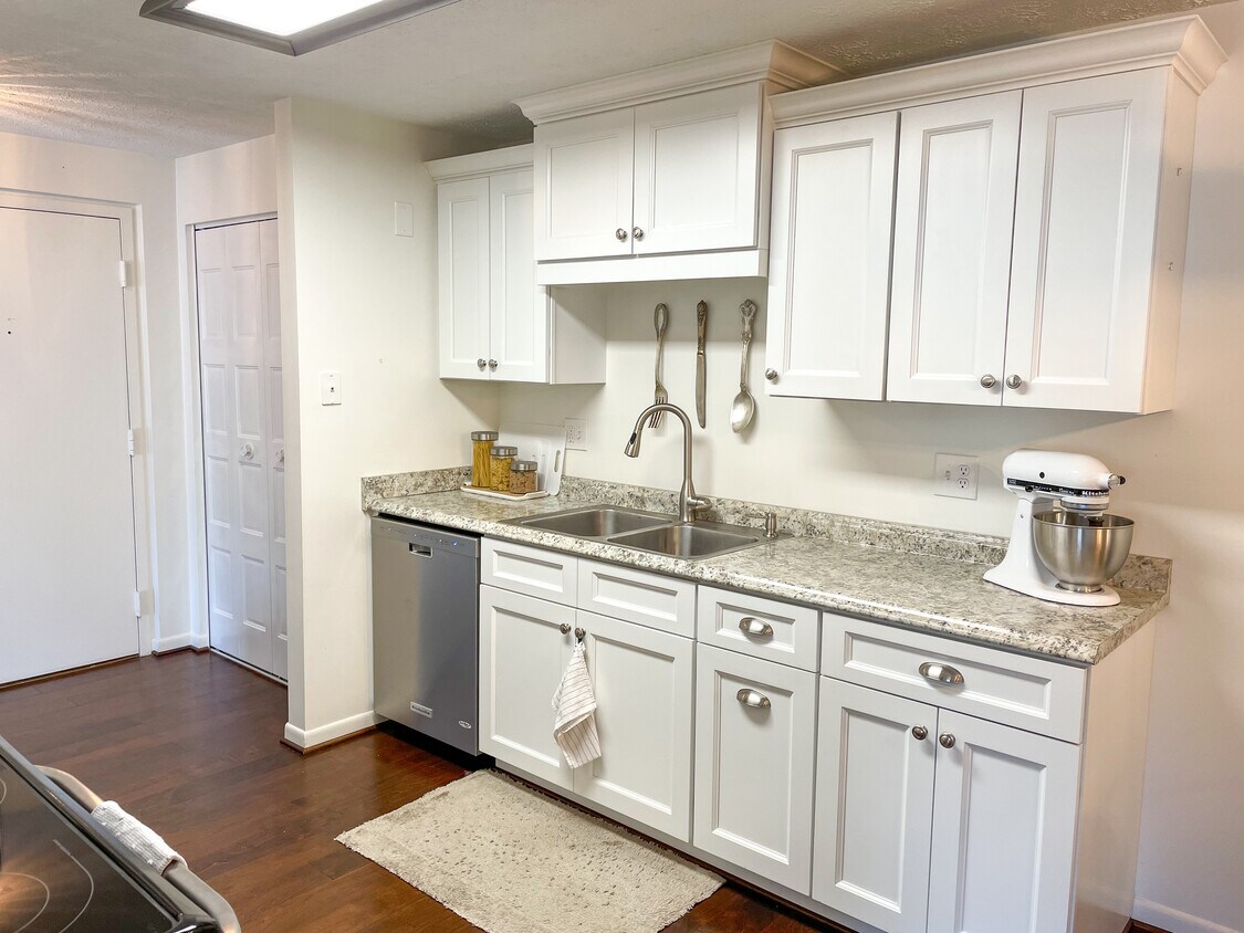 Kitchen with fridge, microwave, dishwasher, oven, and stove. - 29 Great Wood Ct