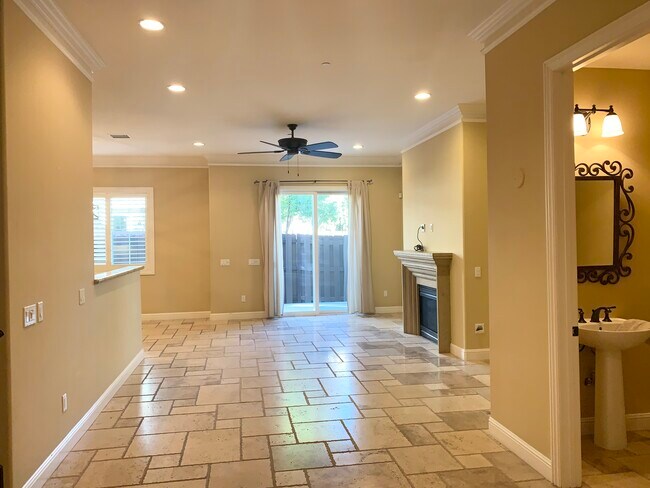 Living room w/ stone floor tiles - 21929 Cortina Plz